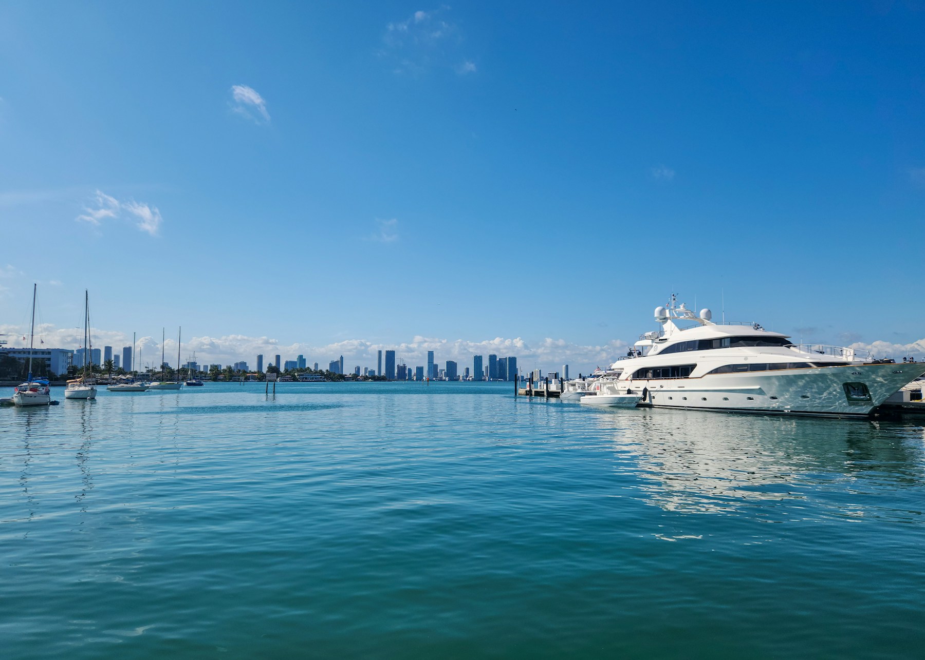 Luxury motor yacht on turquoise water at a Miami Beach marina
